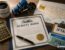 Trucking bonds guide by Ensure Inc. — Oregon Highway Use Tax bond, IFTA fuel tax bond, and BMC-84 broker bond documents on a dispatcher's desk, Barrington IL insurance agency serving Chicago area truckers